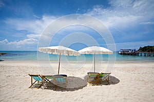 Beach chairs on the white sand beach