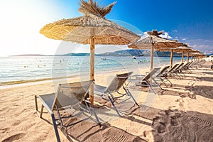 Beach chairs with a white sand on San Ciprianu beach near Porto-Vecchio in Corsica, France, Europe photo