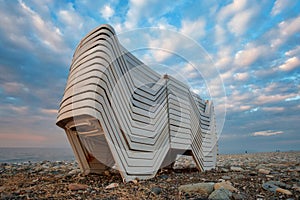 Beach chaise lounges stacked in a row