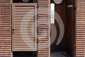 Beach Changing Cabin With Wooden Slat Walls by The Sea. Close-Up