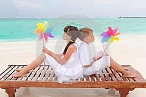 Beach children with pinwheels