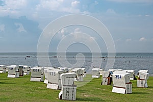 Beach of city Buesum with beach chairs, Schleswig-Holstein, Germany