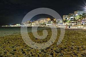 Beach and cityscape of Villajoyosa at night, Spain