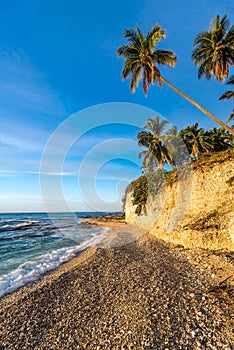 Beach cliff near Barahona with tropical sea and sandy front