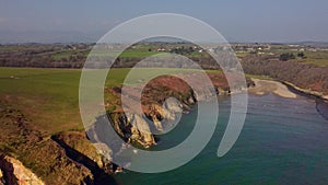 beach between cliffs from drone over Stradbally Cove, Cooper Coast, Waterford, Ireland