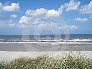 Beach with clouds and blue skie photo