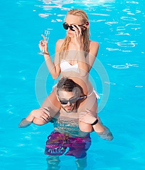 Beach Clubs in Ibiza. Young family man and woman rest on the beach of ocean. Happy young romantic couple in love have