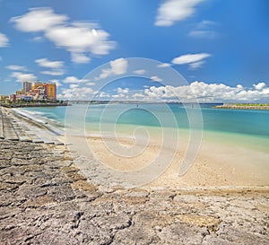 Beach coast lined with palm trees of Distortion Seaside, Oak fashion, Depot Island Seaside buildings and Vessel Hotel Campana in