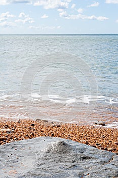 Beach and coastline of West Bay on the Jurassic coast in Dorset taken on sunny summer day