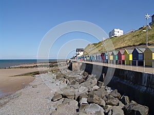 Colourful houses on the beach in a small English town, UK
