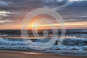 beach at the cote de argent in France with golden sunset