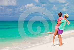 Beach couple walking on romantic travel honeymoon vacation summer holidays romance. Young happy lovers, Cayo LArgo, Cuba