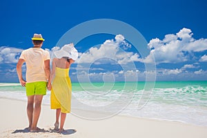 Beach couple walking on romantic travel honeymoon vacation summer holidays romance. Young happy lovers, Cayo LArgo, Cuba