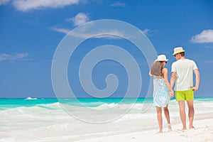 Beach couple walking on romantic travel honeymoon vacation summer holidays romance. Young happy lovers, Cayo LArgo, Cuba