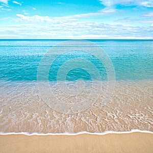 Beach with crashing waves in the tropics