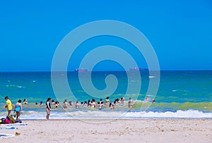 Beach day in summer with  lifeguard sun and sand with bathers on beachside vacations photo