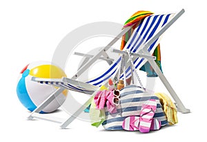 Beach deck chair for sunbathing, isolated on white background, with ball and bag full of accessories, concept a summer beach