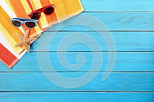 Beach deck summer sunbathing background, sunglasses, copy space