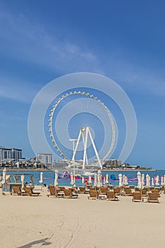 Beach in Dubai with a view of the Ferris wheel