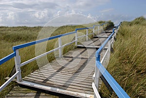 Beach entrance via wooden walkway