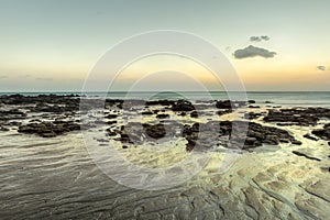 Beach in evening, after sunset during low tide showing sand form