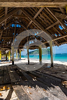 Beach fale`s on a white sand beach at Lalomanu, Samoa