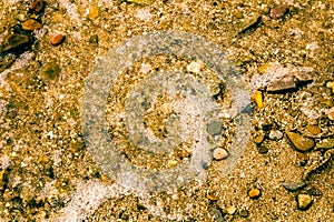 A beach filled with rocks, sand, and broken shells in Geneva-On-The-Lake, Ohio photo