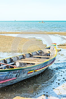 Beach with fishing boats on the sea