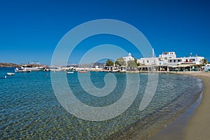 The beach and fishing village of Pollonia in Milos, Greece photo