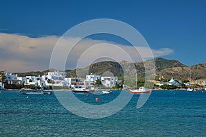 The beach and fishing village of Pollonia in Milos, Greece photo