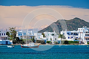 The beach and fishing village of Pollonia in Milos, Greece photo