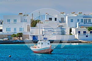 The beach and fishing village of Pollonia in Milos, Greece photo