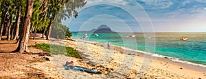 Beach of Flic en Flac with beautiful peaks in the background, Mauritius. Beautiful Mauritius Island with gorgeous beach Flic en photo