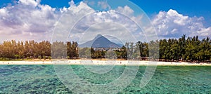 Beach of Flic en Flac with beautiful peaks in the background, Mauritius. Beautiful Mauritius Island with gorgeous beach Flic en photo