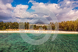 Beach of Flic en Flac with beautiful peaks in the background, Mauritius. Beautiful Mauritius Island with gorgeous beach Flic en photo