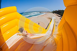 Beach Girl Rides High Water Slide