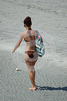 Beach girl walking photo