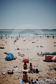 Beach goers in summertime in Baleal