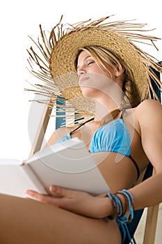 Beach - Happy young woman relax with book