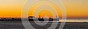 The beach harbor of Blankenberge, belgium, Sunset with colorful sky, architecture of the belgian coast