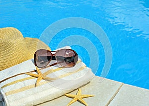 Beach hat, sunglasses, bath towel, starfish.