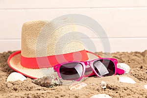 Beach hat with sunglasses and shellfish