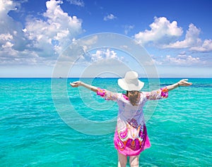 Beach hat woman rear view in Formentera