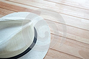 Beach hat on wooden table