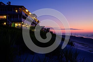 beach hotel lit up during twilight hour