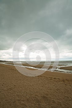 Beach of Houlgate in Normandy with cloudy sky