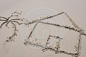 Beach house concept drawn in the sand