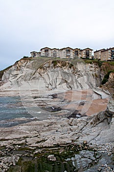 Beach with houses on the cliff
