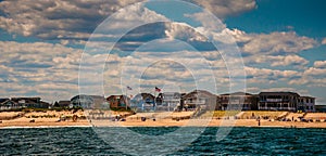 Beach houses and people on the beach in Point Pleasant, New Jersey.