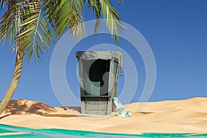 Beach hut with a board in the sand 3d render